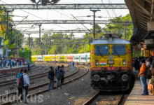 commuter train at railway station in Kerala